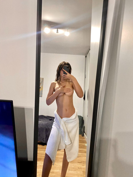 Hot skinny only fans babe flashes her ass while posing with a towel