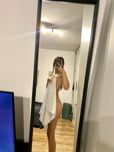 Hot skinny only fans babe flashes her ass while posing with a towel