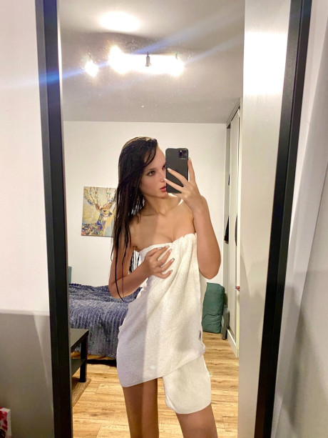 Hot skinny only fans babe flashes her ass while posing with a towel