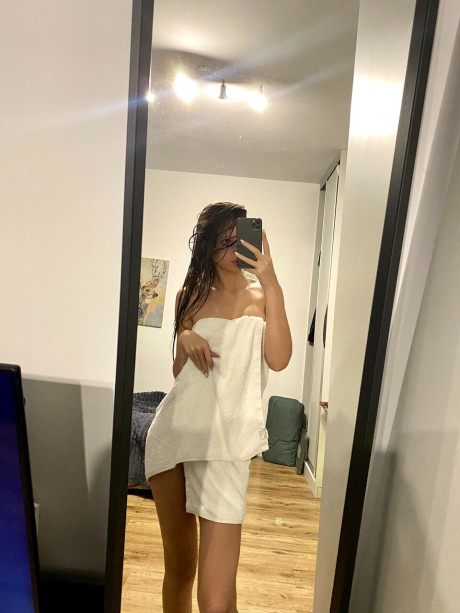 Hot skinny only fans babe flashes her ass while posing with a towel