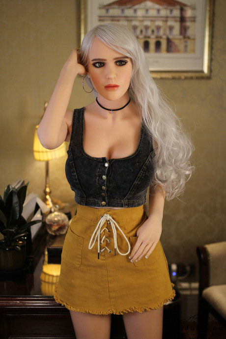 Realistic blonde sex doll shows off her big breasts while undressed