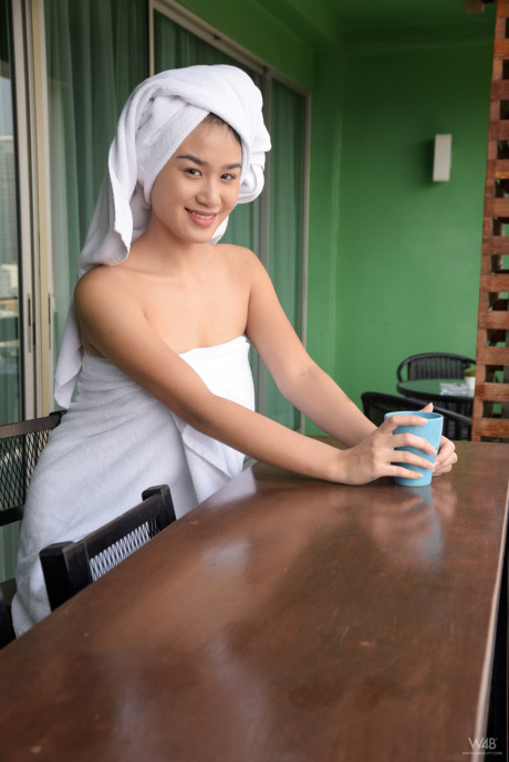 Chinese cutie Kahlisa oils up her perky natural melons and hairy cunt