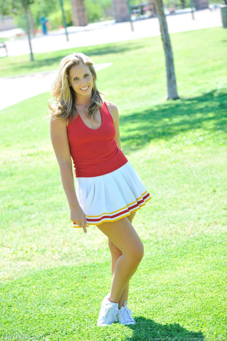 Fine delicious cheerleader Pamela fingers & toys her sexy shaved cunt