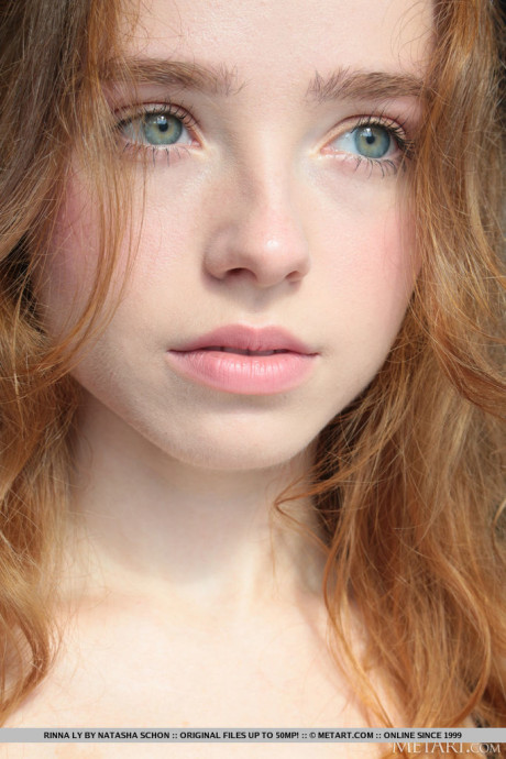 Fresh young ginger Rinna Ly slips off black lingerie in a tempting fashion