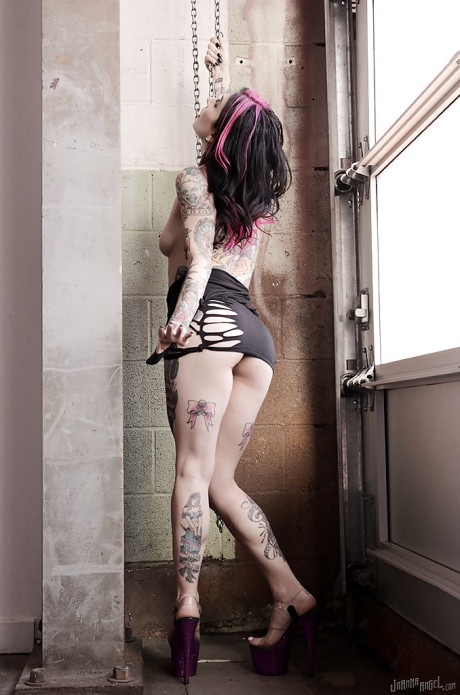 Amateur MILF Joanna Angel showing off her heavily tattooed body in the naked