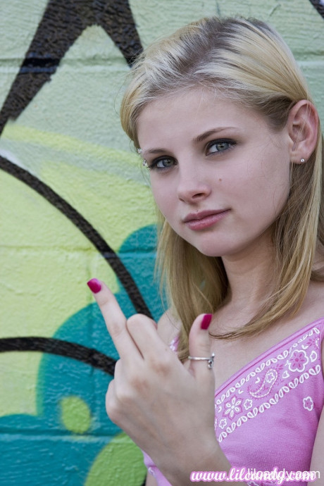 Blondie teenie with attitude flashes her tiny melons & bald twat in an outdoor solo