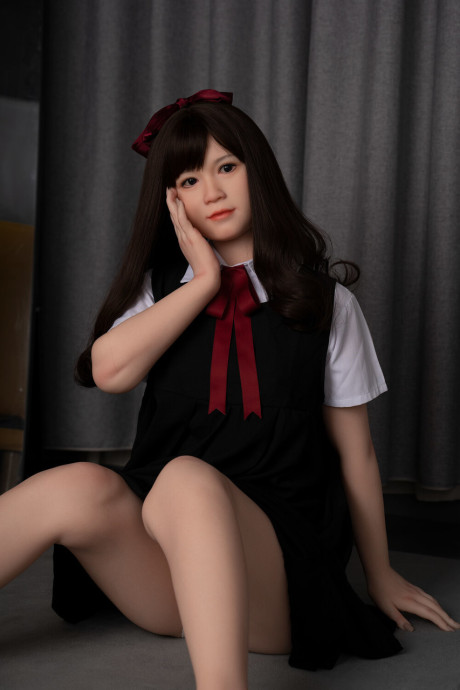 Japanese schoolgirl sex doll teases in her attractive uniform & while fully undressed
