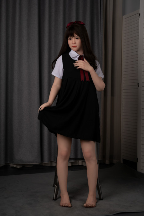 Japanese schoolgirl sex doll teases in her attractive uniform & while fully undressed