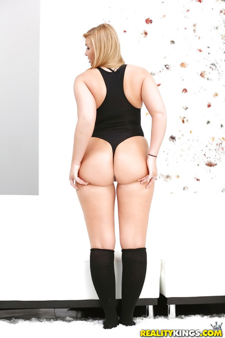 Chubby yellow-haired teenie Melissa May showing off lovely booty in ebony knee socks