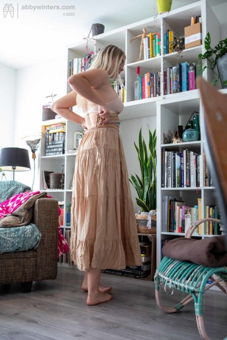 Curvy amateur teenie Denise D teases with her curves while changing her clothes