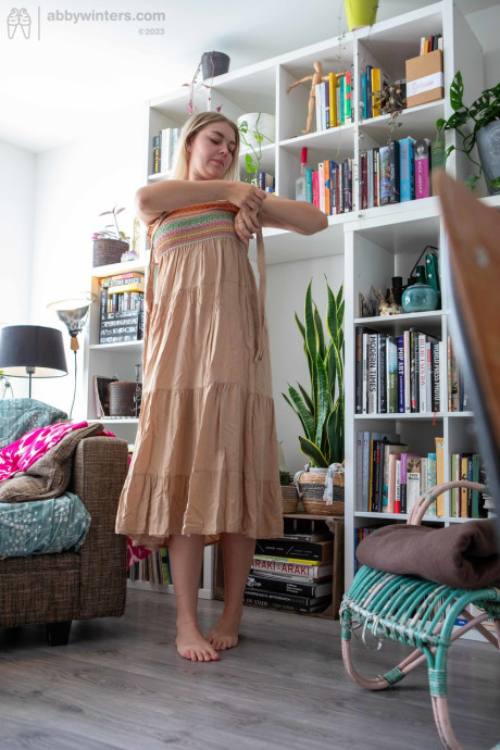 Curvy amateur teenie Denise D teases with her curves while changing her clothes