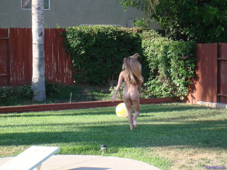 Teen hottie Cari strips nude and sunbathes her fine body in the garden