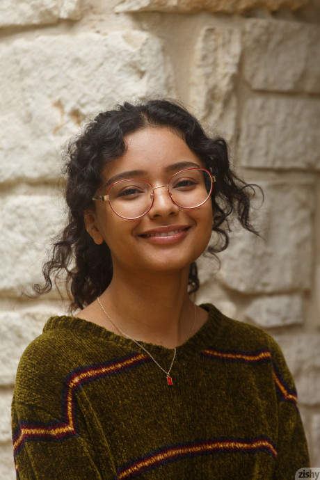 Pretty teen in glasses Renee Macias shows her sweet bum and small tits