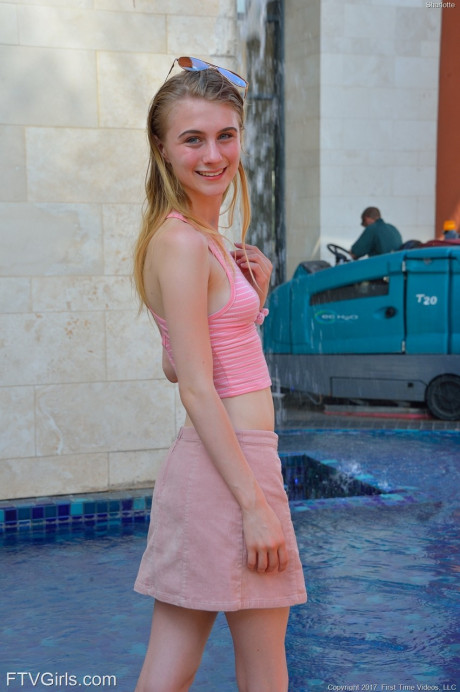 Slim 18 year older Sharlotte flashes her undressed snatch in public places