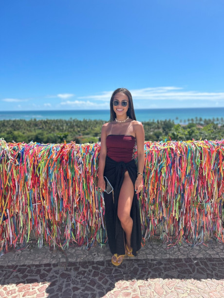 Pretty brunette Nina Carvalhoo sports a winning smile during a SFW shoot