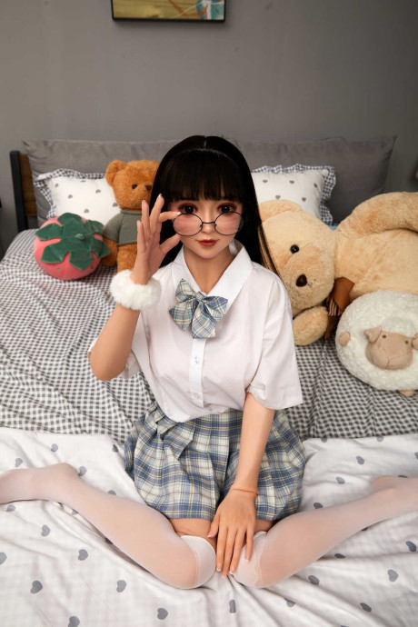 Lovely asian sex doll with pigtails Linda Lizzie posing in her schoolgirl outfit