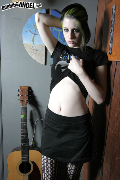 Goth misfit Rubella loses her clothes to display her soft body and perky titties