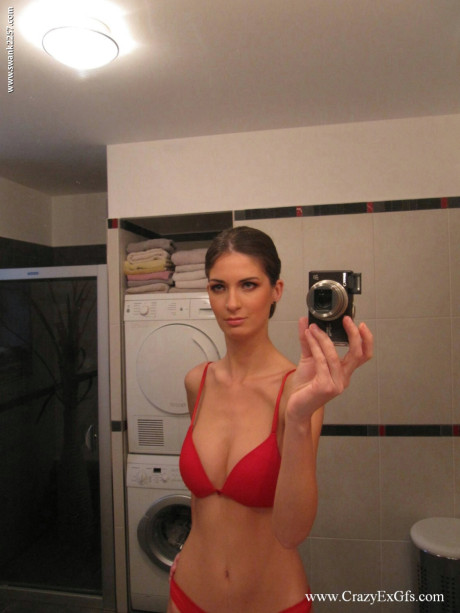Busty brunette Kykola snaps her gigantic melons & her wide curtains up close