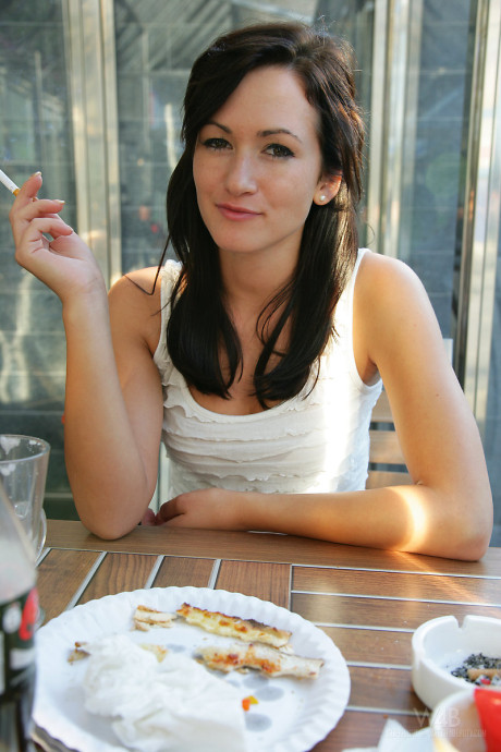 Smoking brunette Tess lifting tight dress on the train for hot undressed upskirt