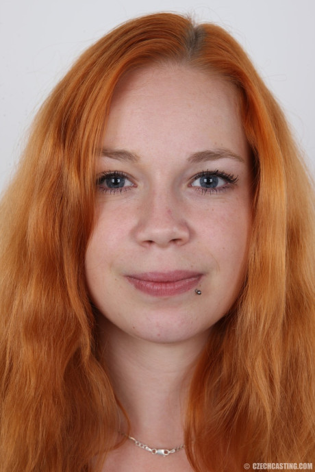 Plump ginger head Tereza crosses her legs after standing totally undressed