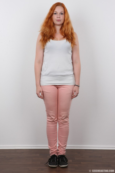 Plump ginger head Tereza crosses her legs after standing totally undressed