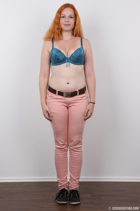 Plump ginger head Tereza crosses her legs after standing totally undressed