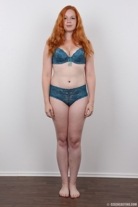 Plump ginger head Tereza crosses her legs after standing totally undressed
