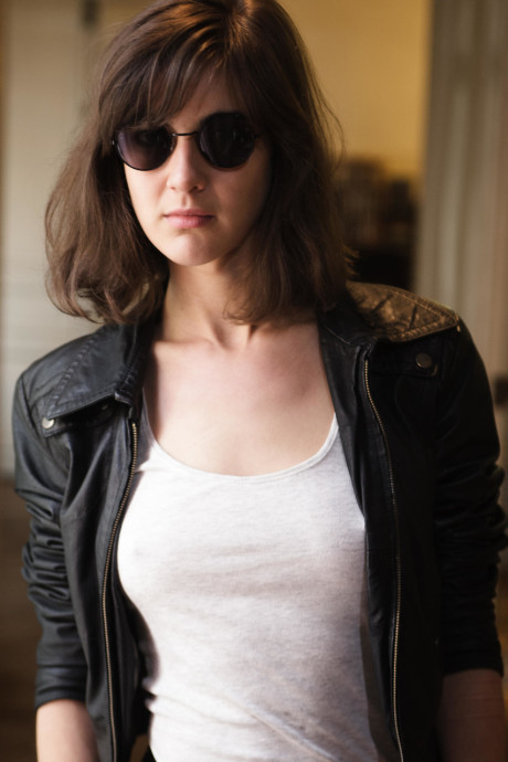 Brunette teenie with a hairy crotch Leonda A strips and poses in a solo