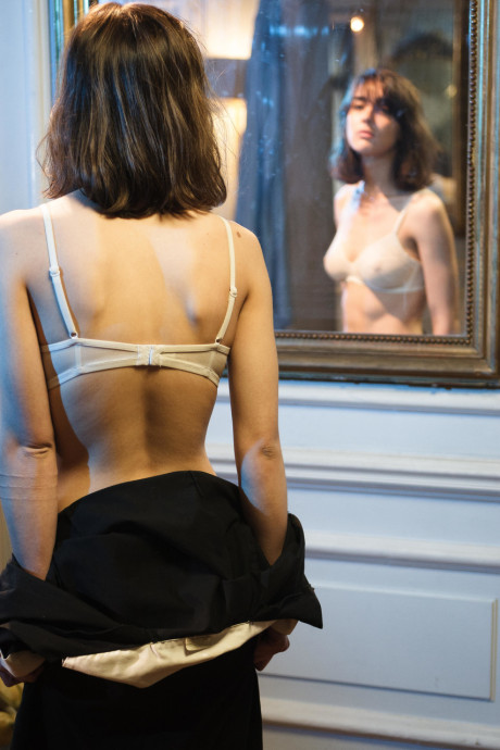 Brunette teenie with a hairy crotch Leonda A strips and poses in a solo