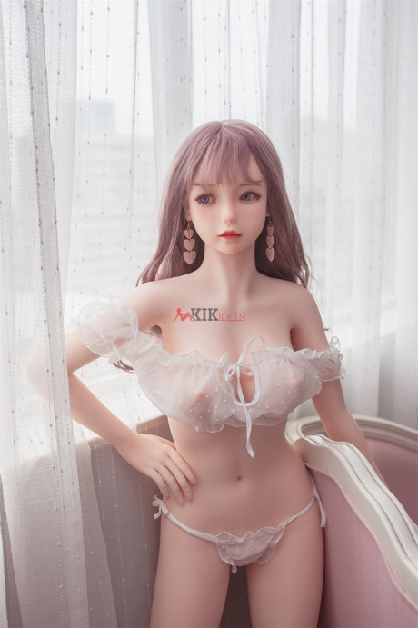 Adorable sex doll Chika showing her perfect boobies and bald twat in the bedroom
