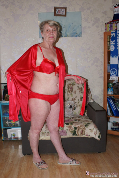 Yellow-haired old lady Belly loses her red undies & shows her saggy melons & furry pussy
