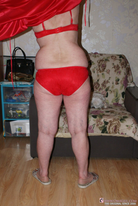 Yellow-haired old lady Belly loses her red undies & shows her saggy melons & furry pussy