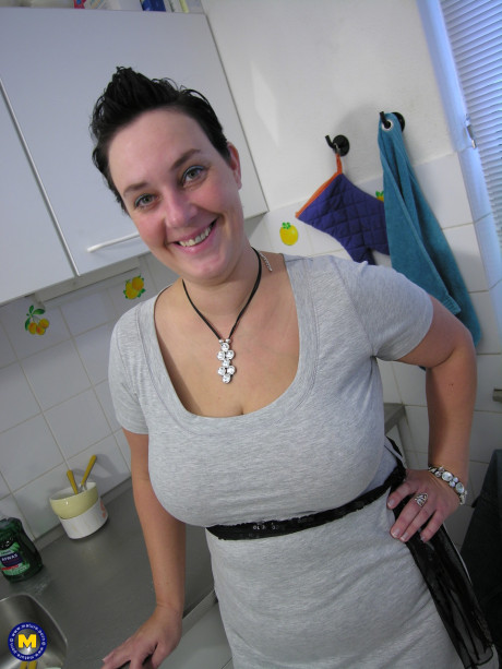 Chubby housewife Lynda reveals her big meaty butt & masturbates in the kitchen