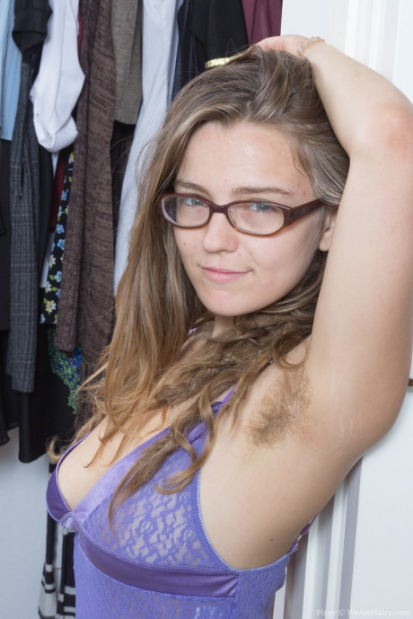 Glasses clad Pixxy is more than happy to show her fresh young hairy armpits and muff