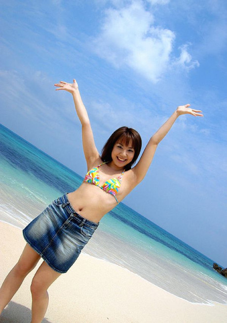 Japanese young Chikaho Ito models non undressed at the beach in a bikini