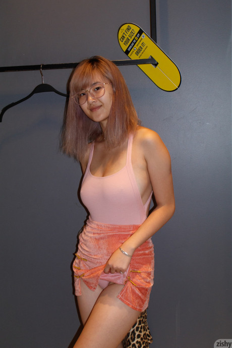 Nerdy chinese babe Barbie Qu flashing her melons and panties in public