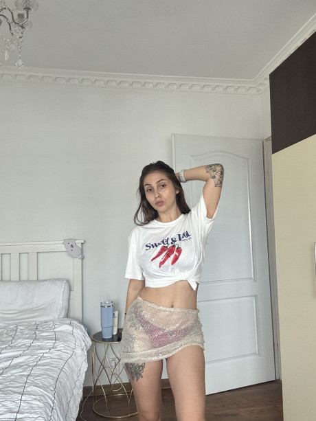 Solo model Sultan Aisu sticks out her tongue while playing with her saggy tits