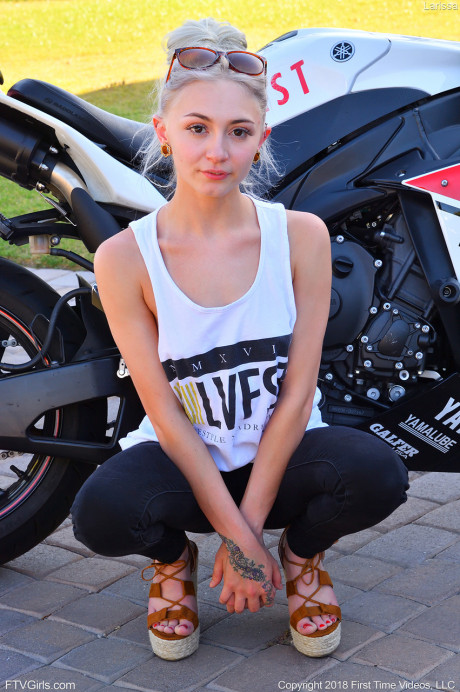 Hot babe Larissa sits on her dildo letting it slowly penetrate deep inside her