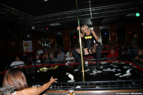 Yellow-haired stripper Kayden Kross unveils her massive melons while performing