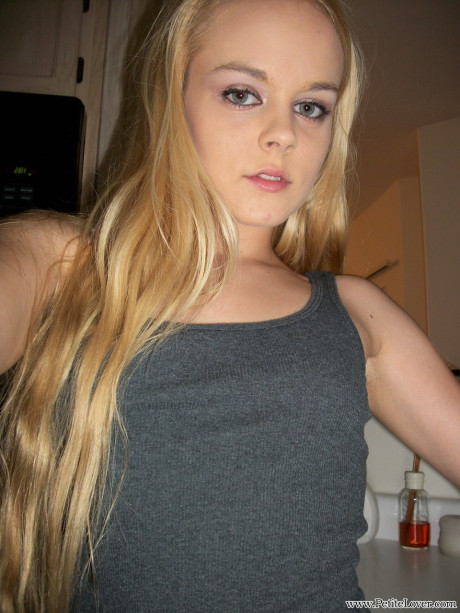 Thin amateur Bri Skies takes selfies while exposing her melons and pussy