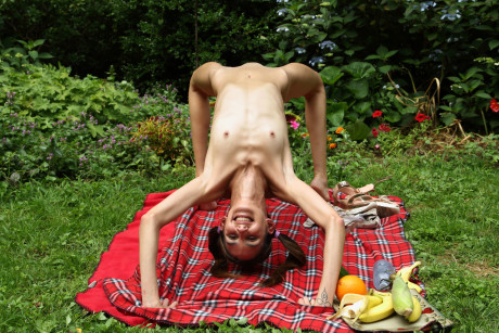 Slender beauty with pigtails Natalia Nix undresses & masturbates at a picnic