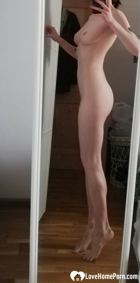 Skinny amateur teenie posing naked and in her cute dress in the mirror