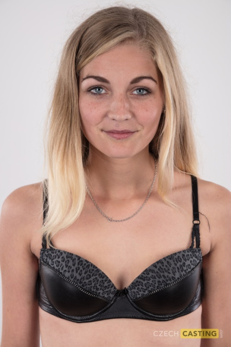 Blonde young Marcela shows her very tiny breasts wearing a black thong
