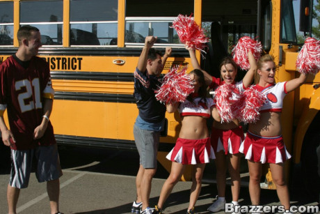 Three slutty cheerleaders starting a fervent debauchery in the school bus