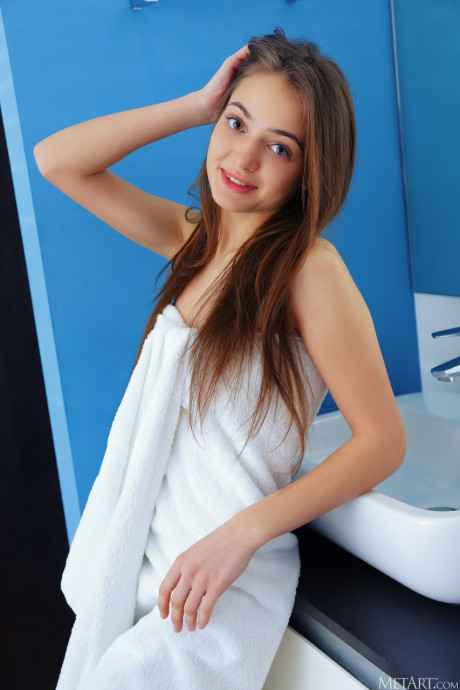 Cute babe Angely Grace shows her tiny melons & her shaved twat in the bathroom