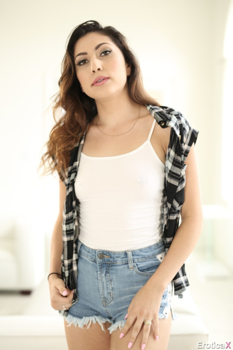 Skinny teen hispanic Judy Jolie getting naked from her outfit to show piercings