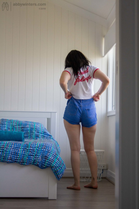 Hot dark haired amateur Mikayla teases with her round booty while dressing