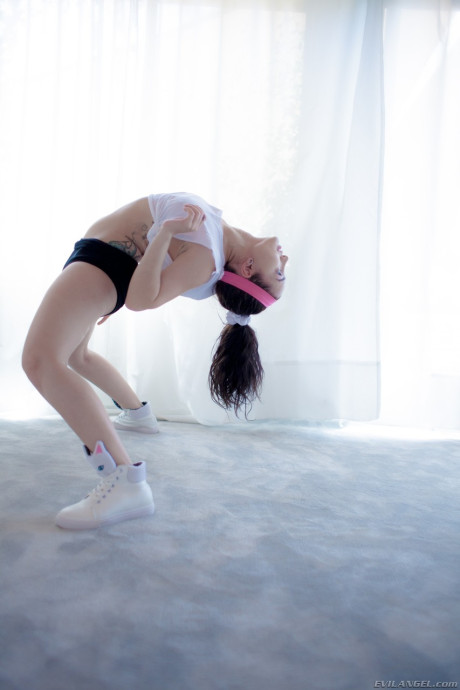 Short brunette Gabriella Paltrova bends over and shows her charming ass