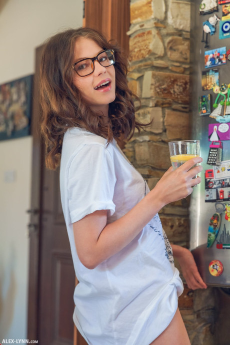 Teenage glamour model with glasses Hilary baking booty undressed in the galley