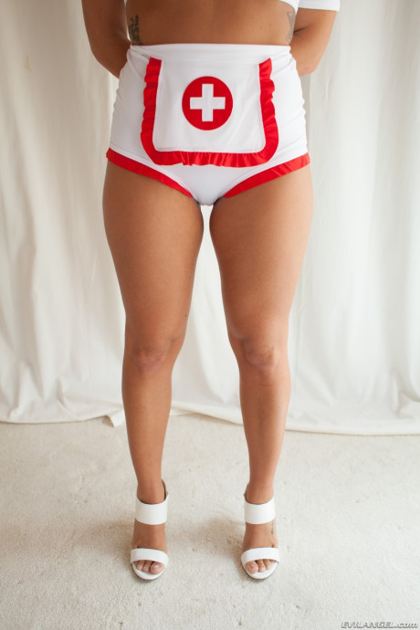 American nurse Keisha Grey flaunts her tight behind and her vagina